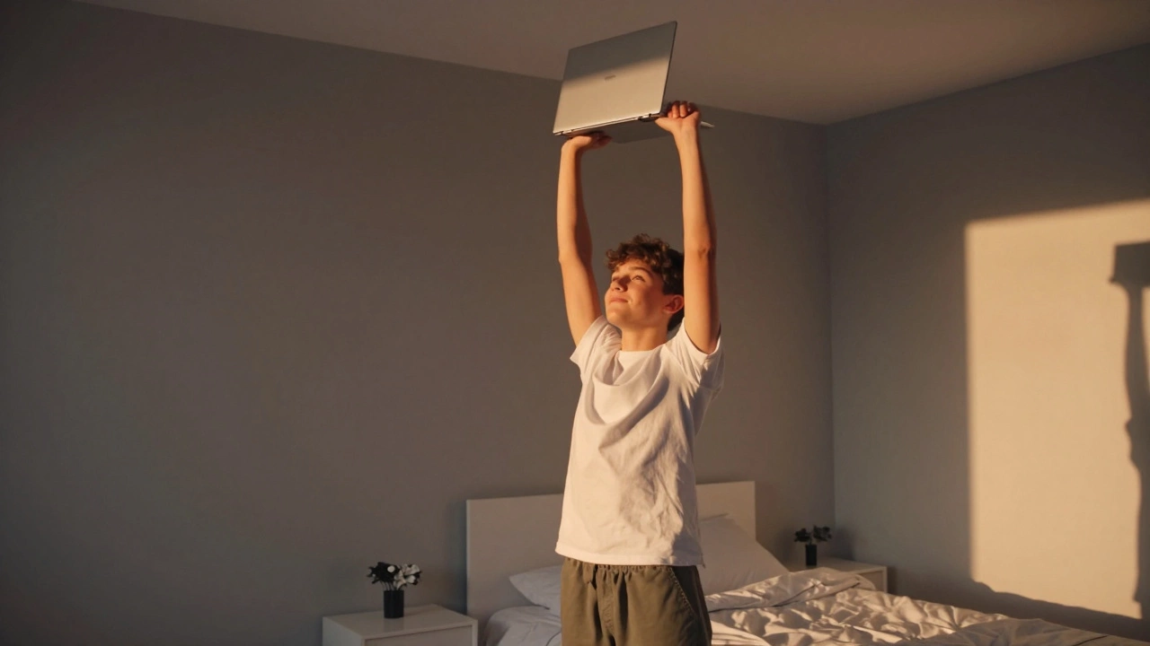 Student closes laptop and stretches during golden hour.